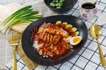Barbecued crispy pork in sauce with rice