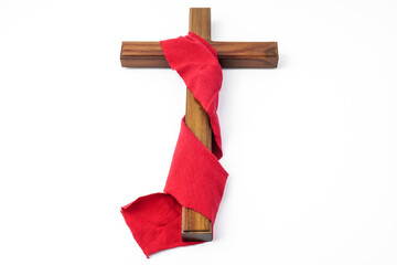 Jesus Wooden cross wrapped with red cloth. Catholic Christians Good Friday Ceremony. Isolated on...