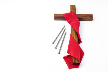 Jesus Wooden cross wrapped with red cloth next to nails. Catholic Christians Good Friday Ceremony. Isolated on white background with empty blank copy text space. - obrazy, fototapety, plakaty