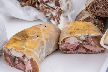 image with traditional Romanian winter holidays meat foods for sale in an outdoors market in Sibiu, Romania.