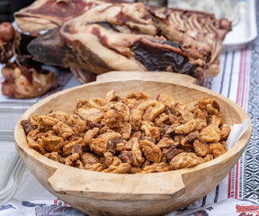 image with traditional Romanian winter holidays meat foods for sale in an outdoors market in Sibiu, Romania.