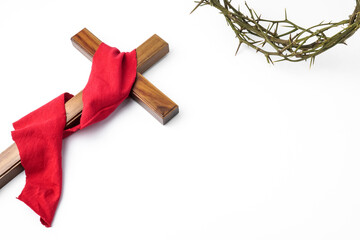Jesus Wooden cross wrapped with red cloth and Crown of Thorns used by Catholic Christians on Good...