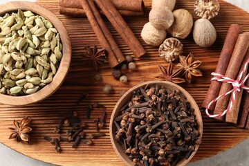 Different aromatic spices on table, top view