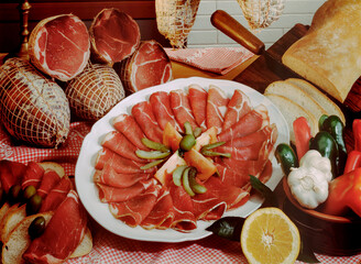 Detail of a table set with cured meats