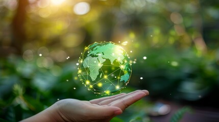 A hand holding a digitally enhanced green globe with interconnected nodes, symbolizing global sustainable energy and connectivity.