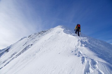 Naklejka na ściany i meble skier on the top of mountain, Vaiuga Peak, Fagaras Mountains, Romania