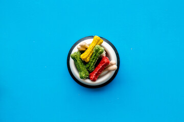 Food and treats for pets. Bowl full of dog chew bones