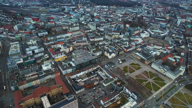 Aerial around the downtown of the city Kassel in Hessen, Germany on a cloudy day in early spring