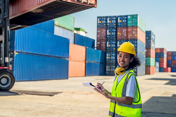 Cargo black worker woman holding clipboard working in container shipyard 