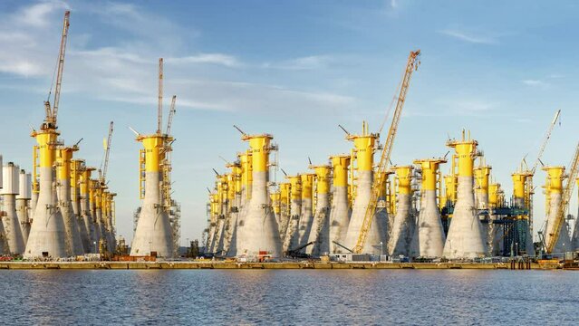 Construction of gravity-based structures (GBS), engineered for offshore wind farms, each one will be moved offshore and will be the base for a giant wind turbine