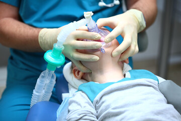 A small child is undergoing surgery. Oxygen mask on the child's face. Anesthesia during surgery....