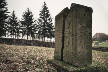 Old Stone Cross - Grave -  Graveyard - Scary - Cemetery - Halloween - Mysterious  - Tombstones - Background - Concept - Religion - Spooky - Creepy 