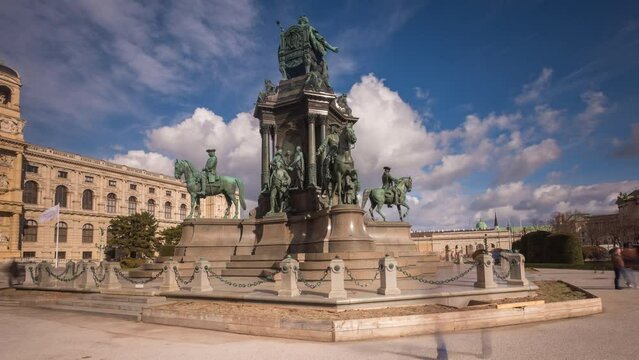 Empress Maria Theresia Monument timelapse hyperlapse footage and Museums Quartier on a background in Vienna Austria. Famous Natural History Museum with park and sculptures in Vienna city, Austria