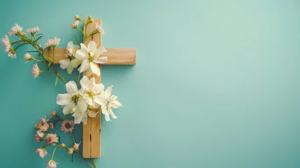 Fotobehang Religion background with a wooden cross and spring flowers against a blue background. Christianity Feast, Easter, Palm Sunday, Chrismnaing, or church wedding. © Zaleman