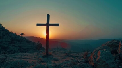 Symbol of Jesus' crucifixion against a sunset-sky mountain backdrop