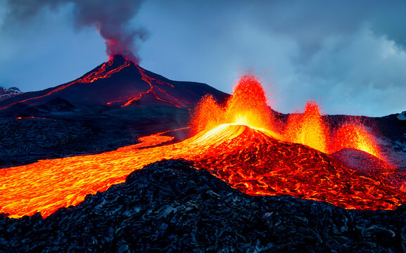 Volcanic eruption and boiling magma and flowing lava.