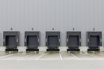 Row of gray loading docks of a warehouse or distbution center