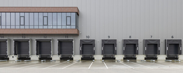 Row of gray loading docks of a warehouse or distbution center