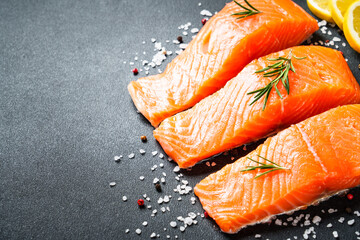 Salmon fillet, raw fresh fish with rosemary and spices.