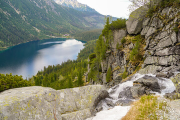 breathtaking waterfall above the Morskie Oko mountain lake and hiking destination 