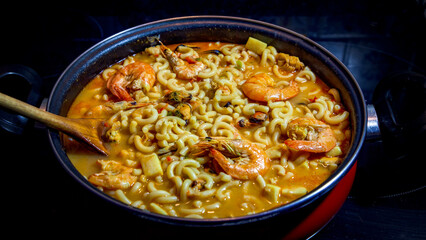 Delicious fideua cooking at home close up view