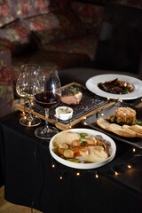 the table is covered with various meat dishes. delicious dishes are prepared for the celebration