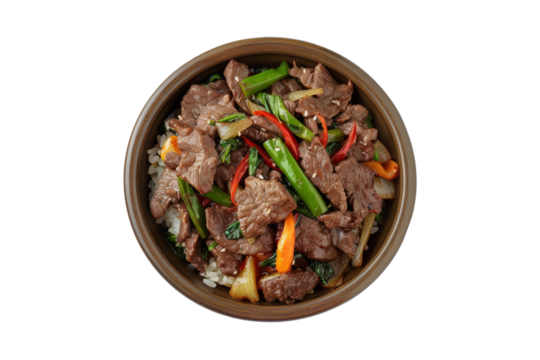 Mongolian beef stir-fry, featuring thinly sliced beef stir-fried with vegetables in a savory sauce, served over steamed rice.