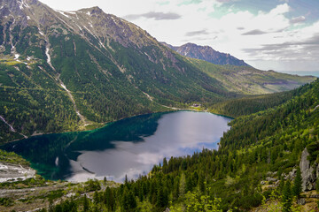 Naklejka na ściany i meble spectacular panorama of Morskie Oko mountain lake and hiking destination 