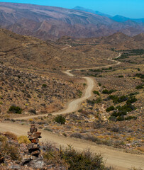The Weltevrede road winds its way through the foothills of the Swartberg mountains in the Great...