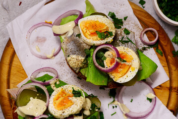 Polish bread with herring with eggs  and  sauce.top veiw