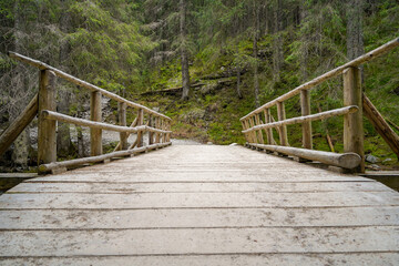 Morskie Oko trail , hike in the Tatras mountains , old wooden bridge over the river