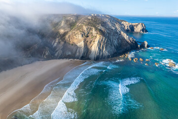 Aerial drone view of Cordoama Beach in Portugal with sandy shore, cliffs and ocean - 740915096