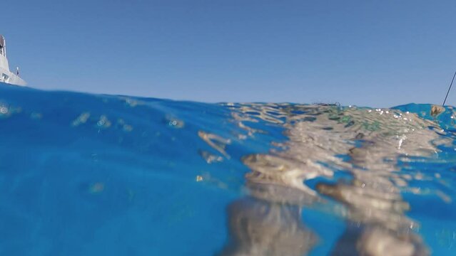 Woman swimming at iconic tropical paradise beaches of Voutoumi and Vrika with turquoise clear sea, Antipaxos island, Ionian, Greece, slow motion