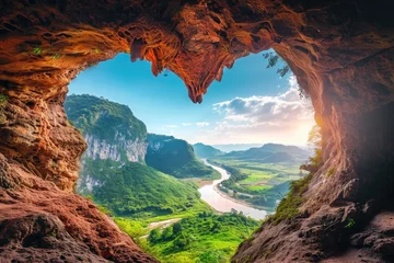 Keuken spatwand met foto A stunning cave provides a breathtaking view of a flowing river and towering mountains in this captivating photograph, Heart-shaped cave opening overlooking a tranquil valley, AI Generated © Iftikhar alam