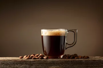 Fototapete Rund Espresso coffee glass cup on a brown background. © Igor Normann