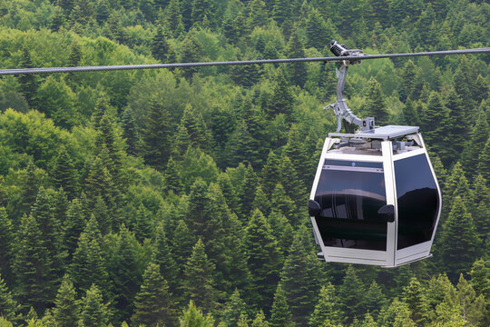 Funicular cable car over the forest. at the mountainside of Uludag. Pine forest, top view. Uludag, Bursa, Turkey