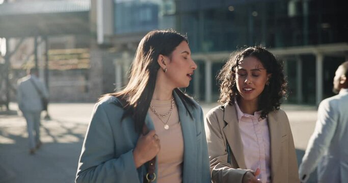 Walking, talking and business women in city in discussion, conversation and speaking on morning commute. Corporate office, teamwork and workers in urban town for journey, travel and networking