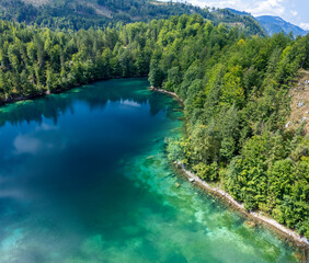 Aerial of mountain lake Gruner see, green lake in the Styria, Austria on a clear autumn day