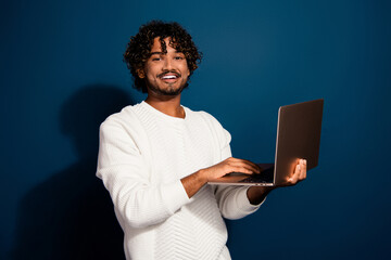 Photo of funky cool man wear white sweater communicating modern gadget isolated dark blue color background