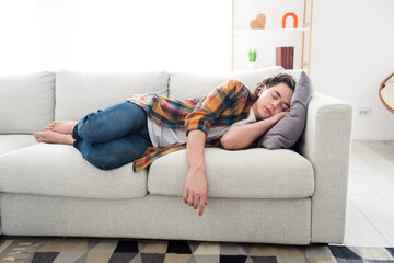 Photo of tired overworked guy dressed checkered shirt lying sofa having daydream sleep indoors...