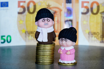 Figures of old retired people on different piles of money coins, concept of income inequality