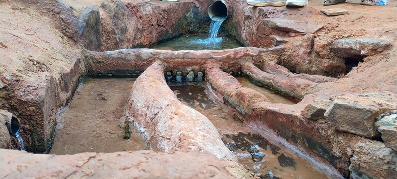 Close up on The foggaras, an ingenious irrigation system essential in the Algerian oases, they make it possible to distribute the water so precious in the arid desert. Timimoun, Algeria.