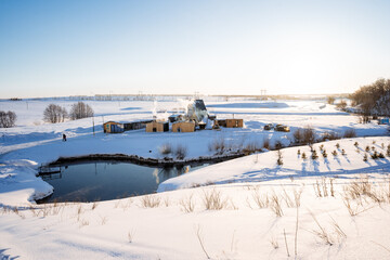 Heart-shaped mountain lake, winter landscape, sunset, beautiful nature of the Ural Mountains, blue lake, thermal spring.