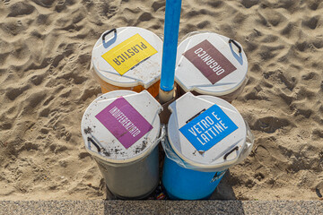 Recycle bins with separate slots for plastic, aluminum and glass, organic and undifferentiated waste