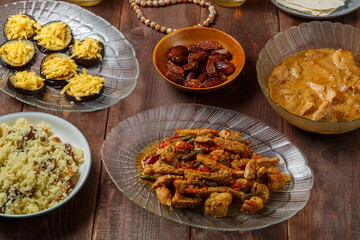 Shabbat table with traditional holiday food meat and sweets menorah. Horizontal photo.