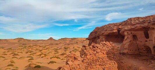 the remains of ancient castles made of stone and red clay built on a rock in the middle of the...