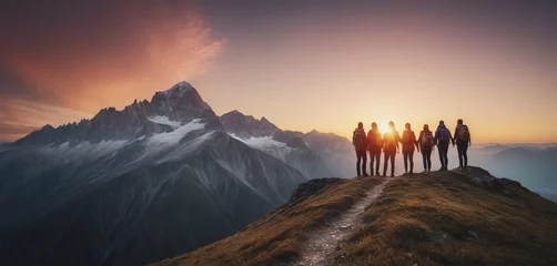 Poster Panoramic view of team of people holding hands and helping each other reach the mountain top in spectacular mountain sunset landscape © Riko Best