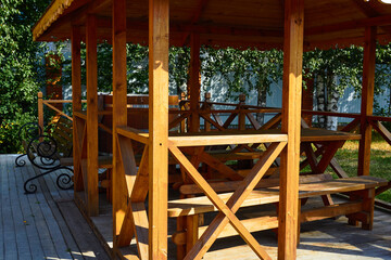 wooden gazebo made of timber. Garden furniture.