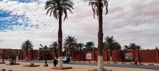 Street view of the beautiful architecture made of red clay in the city of Timimoun, Algeria