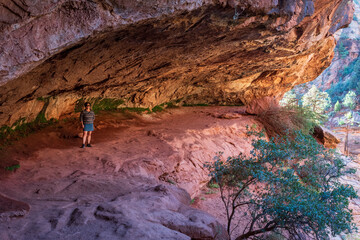Middle-aged woman hiking the Zion-Mount Carmel Tunnel trail in Zion National Park, Utah.